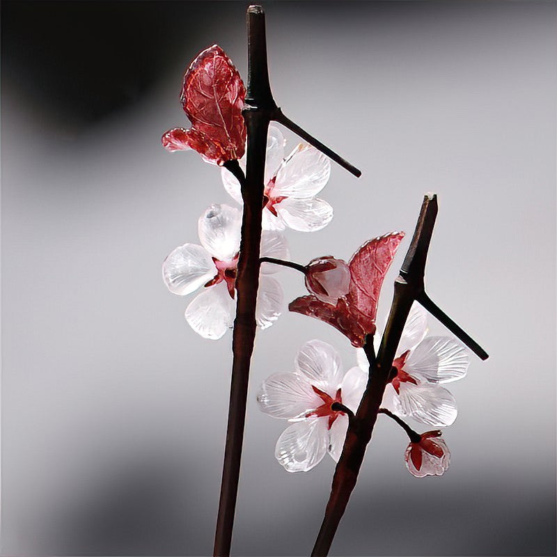Model styling the stick in a half-up knot highlighting flower accent