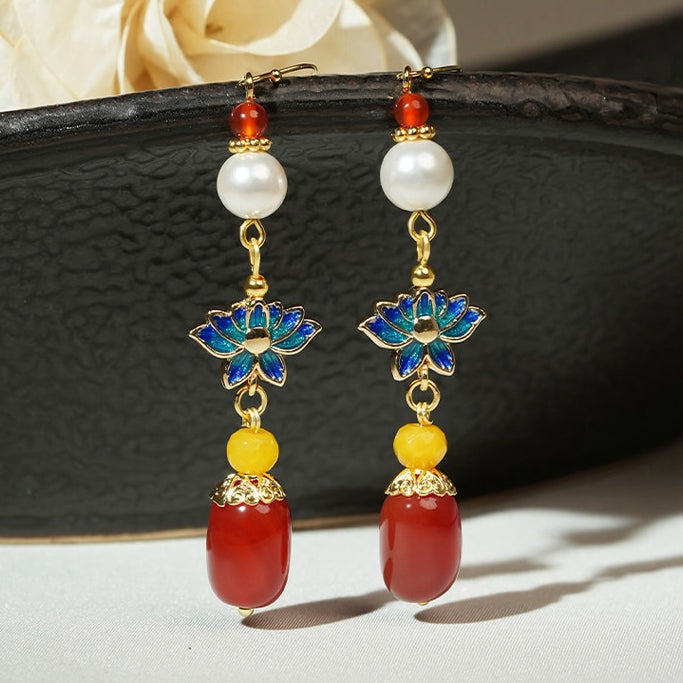 Blue lotus and red bead drops earrings, paired display