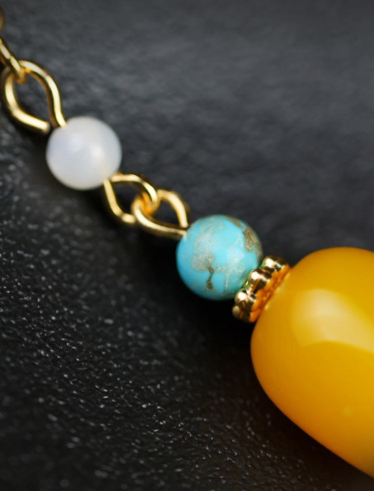 Yellow stone and pearl drops earrings, paired display