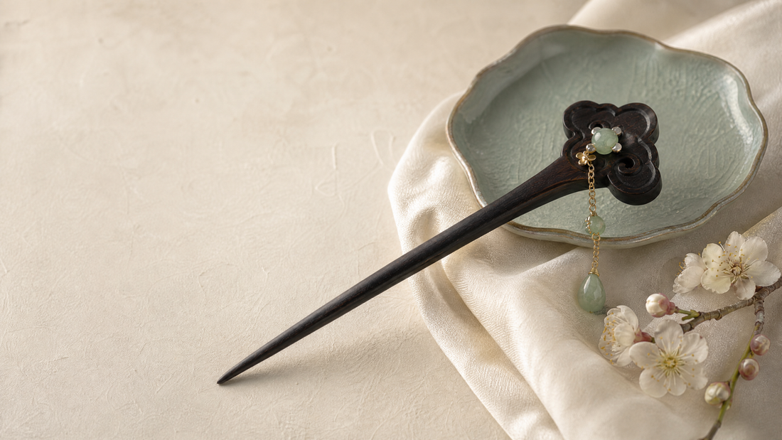 Dark artisan hair stick with jade-green ornament and plum blossoms on ivory silk