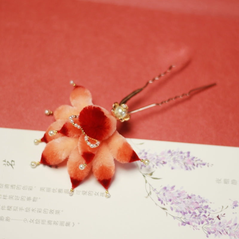 Warm-toned woodlike hair stick with fox charm resting in a loose bun