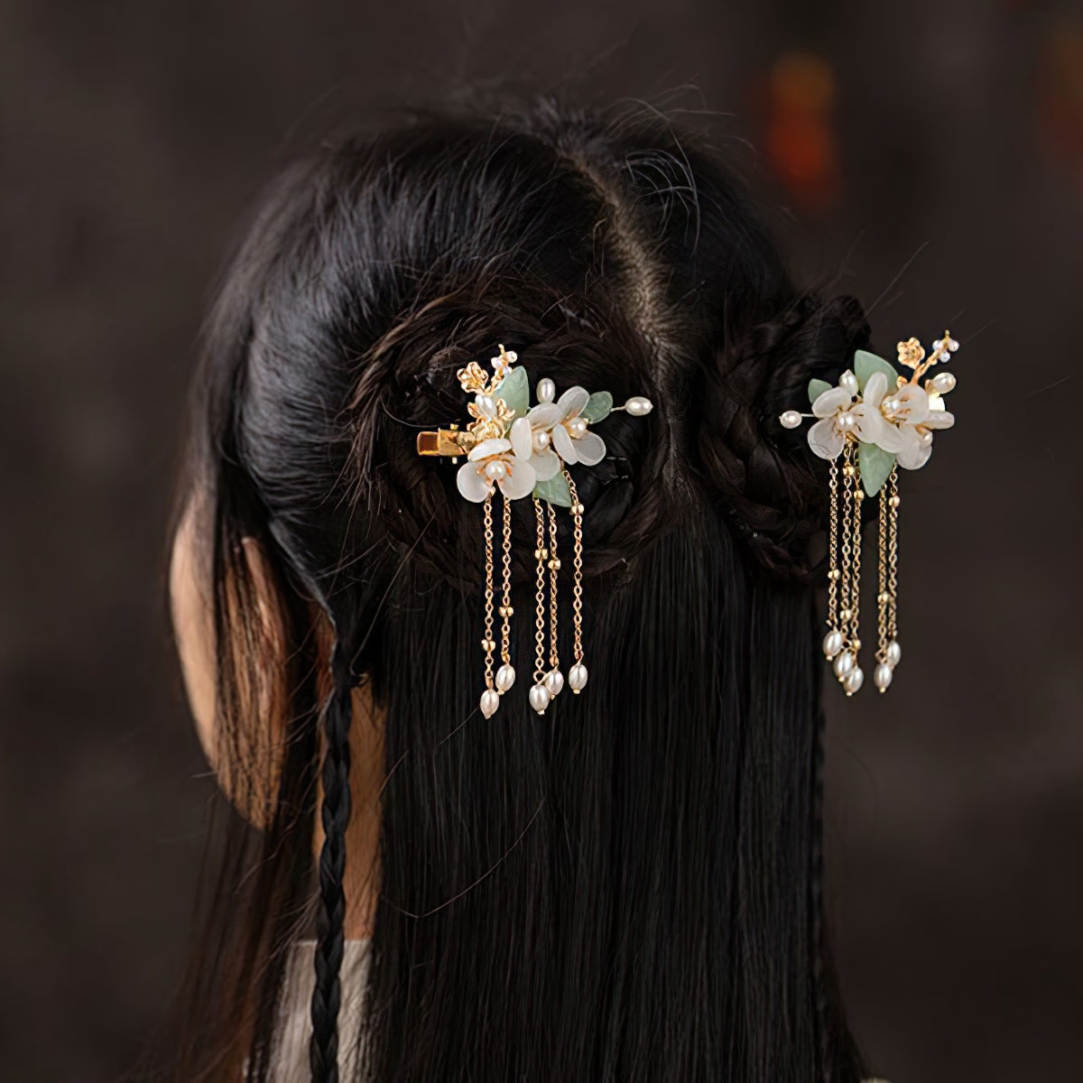 Close-up showing delicate metal accents and painted floral motif on shaft