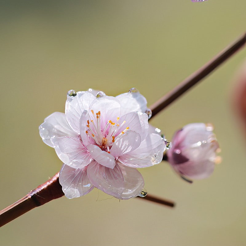 Close-up of carved floral end showing delicate petal details and warm brown tones