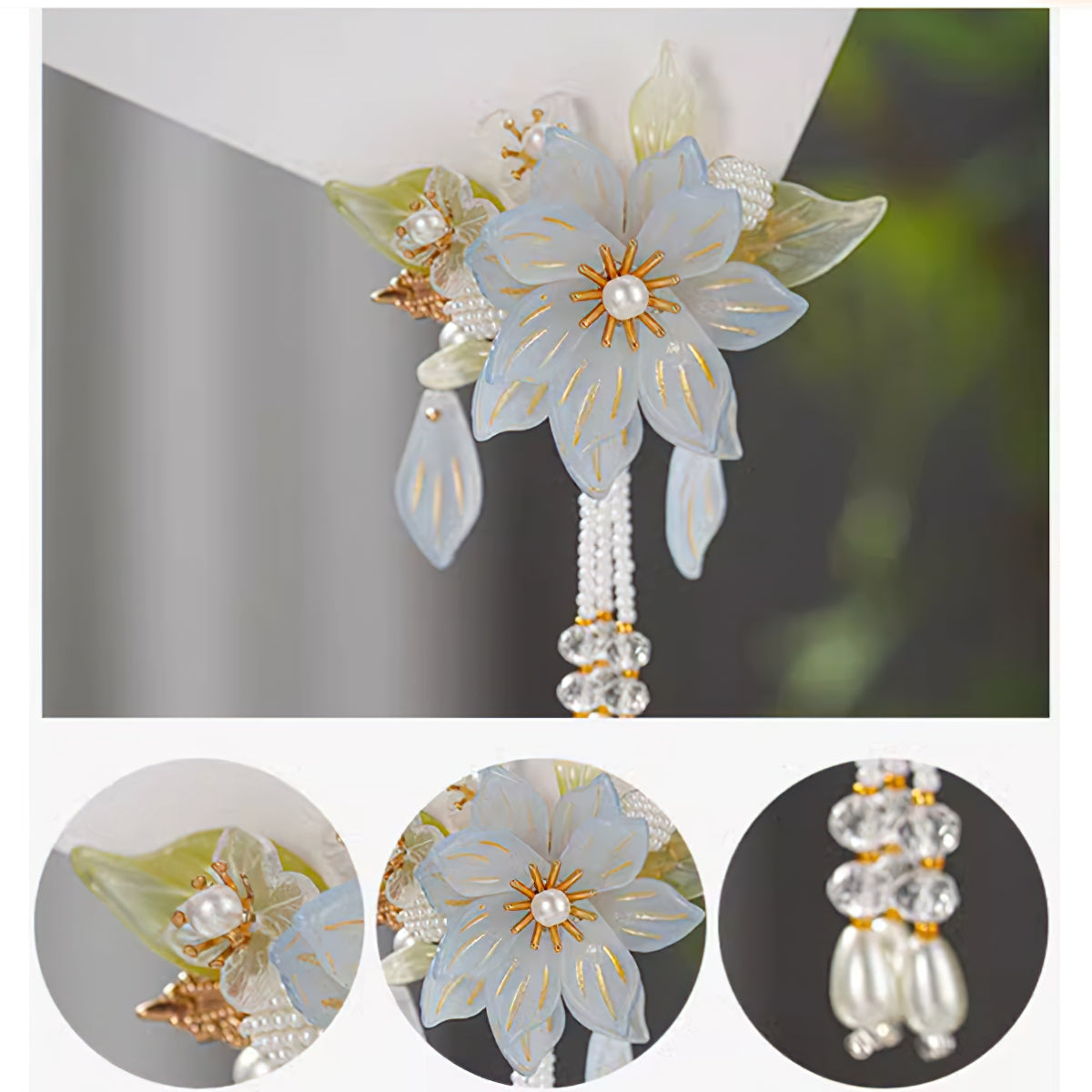 Clustered blossom arrangement in soft pastel hues placed at crown adds romantic flair
