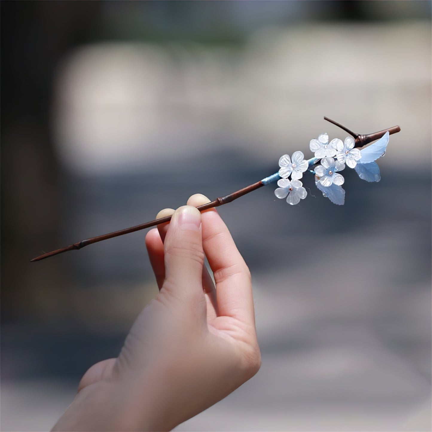 Side view showing smooth wood-look finish and delicate painted petals