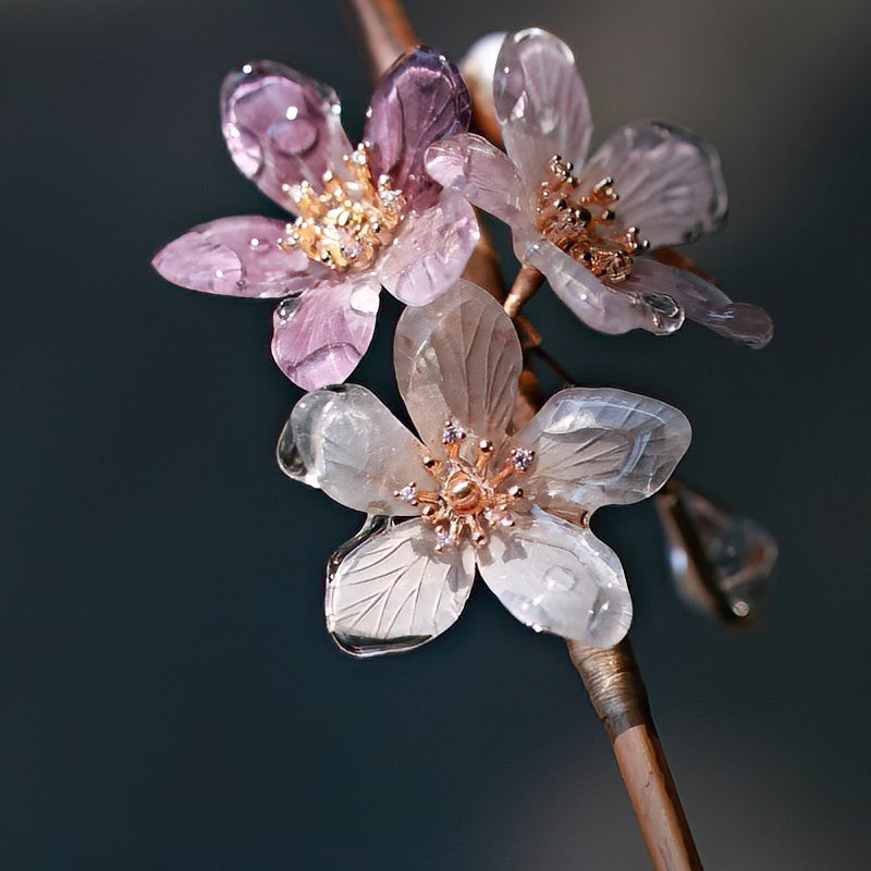 Styled in flowing half-up hair, the floral stick adds subtle elegance