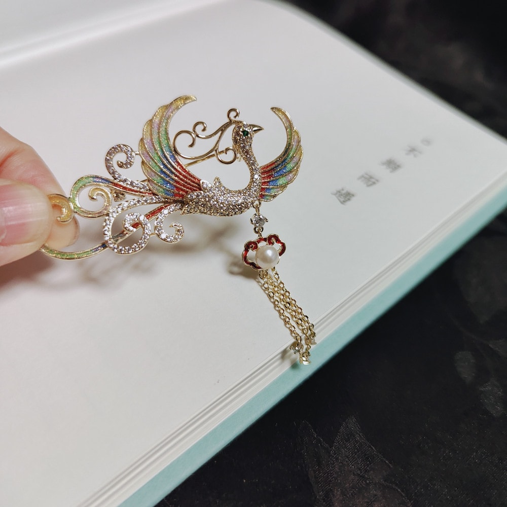 Brooch displayed on ivory Qipao collar highlighting floral butterfly detail