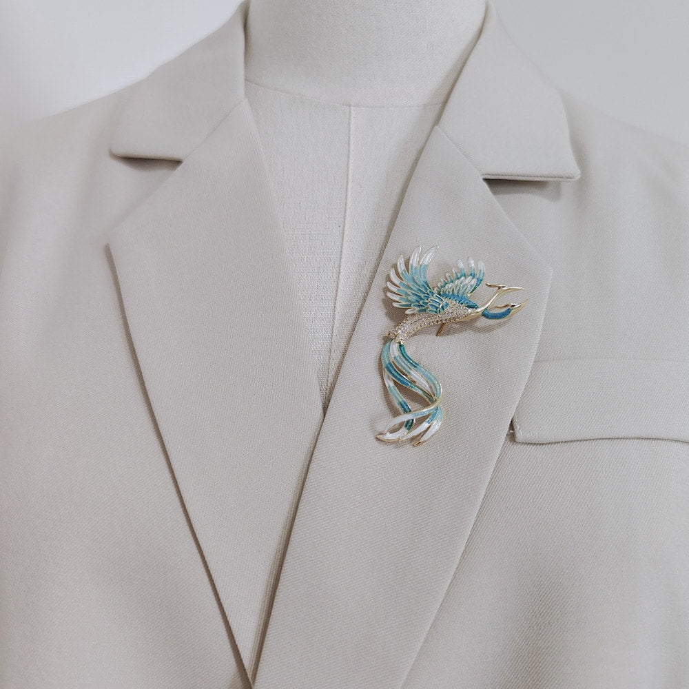Close-up of phoenix wing detailing showing pearlescent bead and enamel gradient