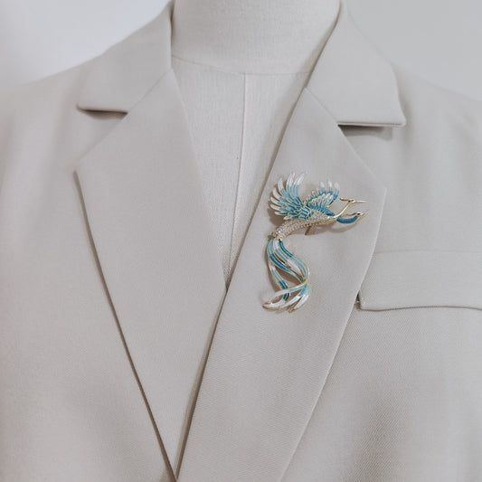 Close-up of phoenix wing detailing showing pearlescent bead and enamel gradient