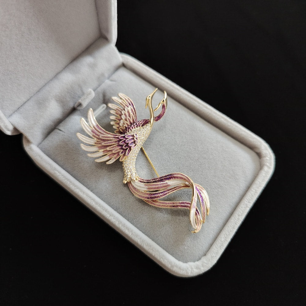Three-quarter angle showing floral motifs and shimmering enamel colors on pin