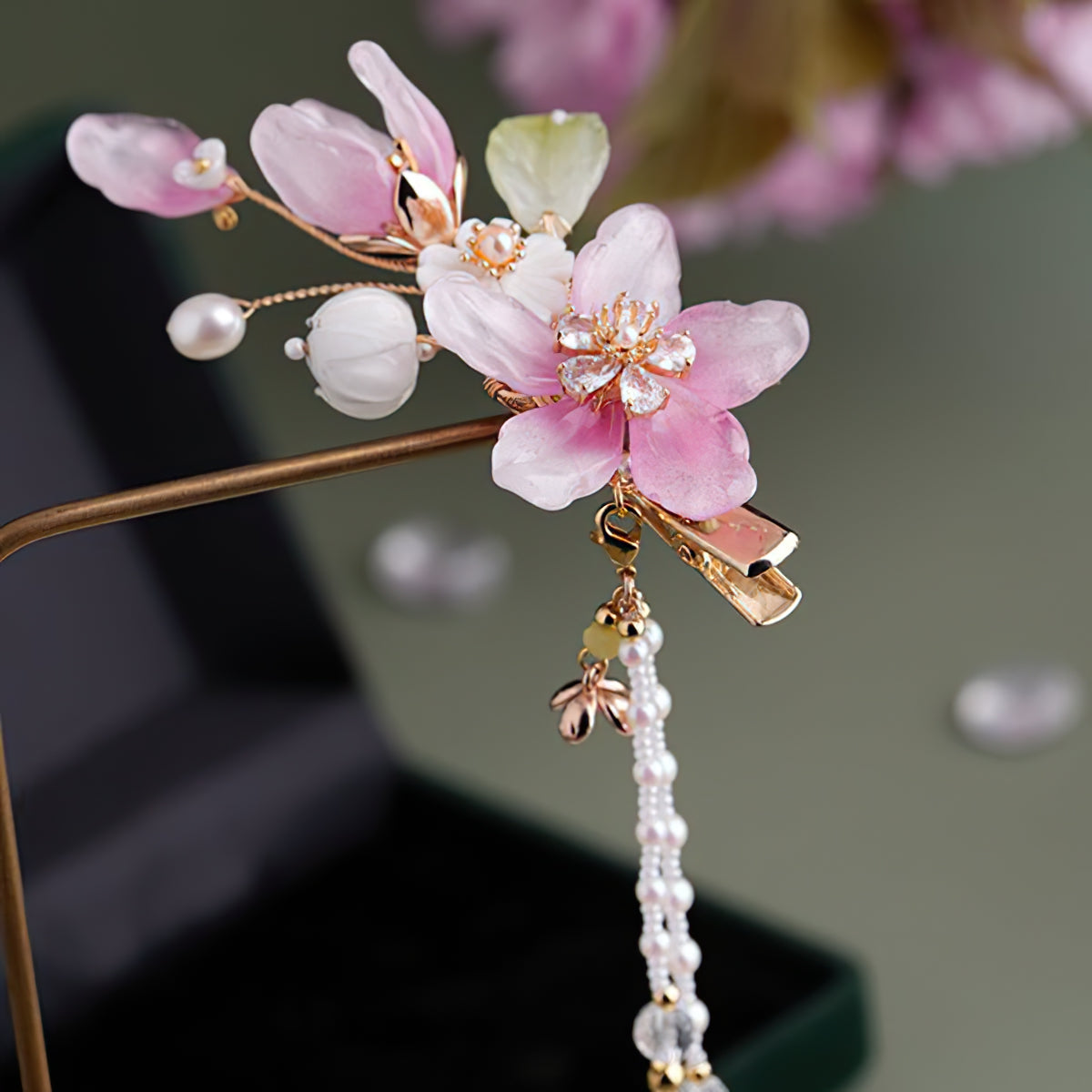 Small petaled flower clip tucked into side-swept braid for accent