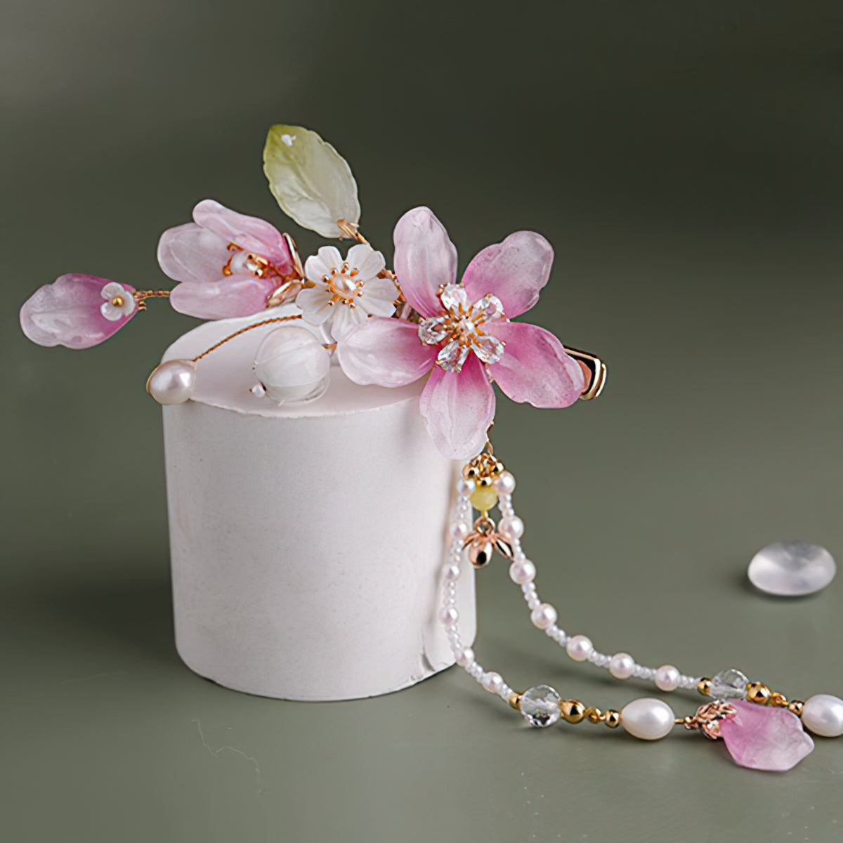 Warm-hued blossom accessory paired with traditional attire for polished updo