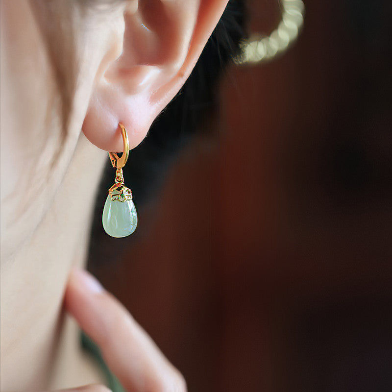 Green jade pendants earrings, close detail