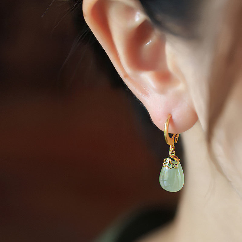 Green jade pendants earrings, side profile