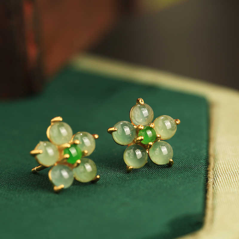 Soft green floral studs earrings, front view