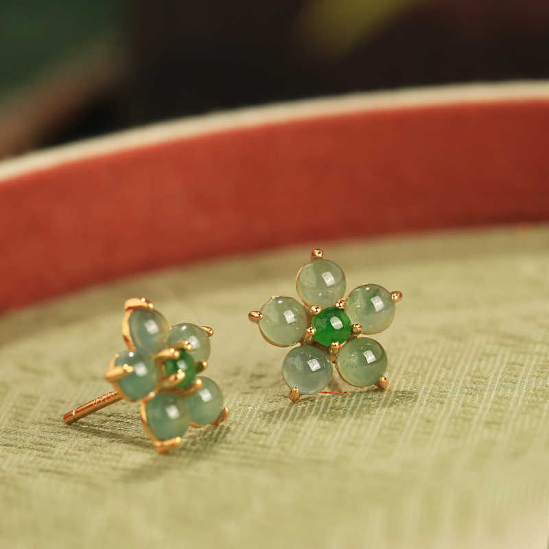 Soft green floral studs earrings, worn styling view