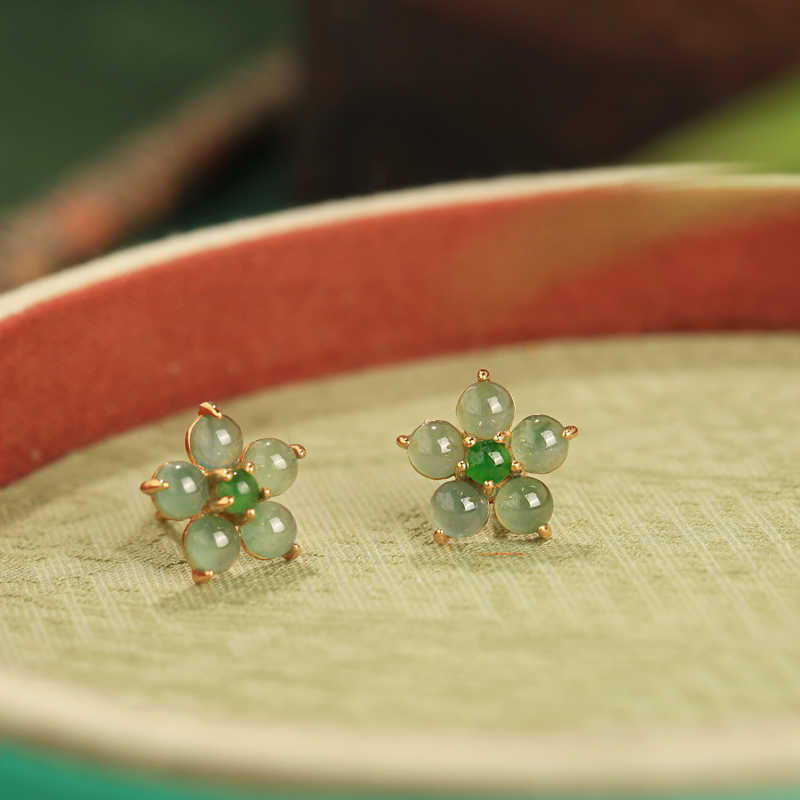Soft green floral studs earrings, paired display