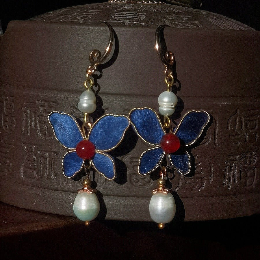 Butterfly and pearl drops earrings, close detail