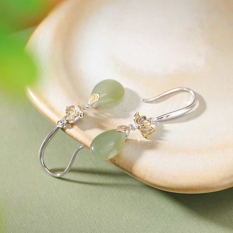 Lotus flower hook drops earrings, worn styling view