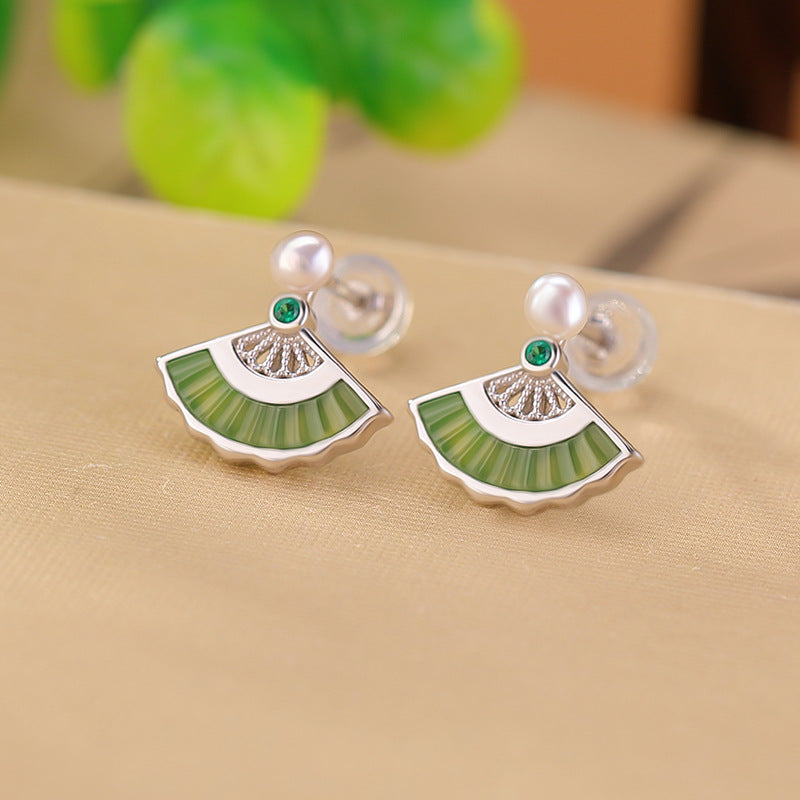 Openwork green studs earrings, worn styling view