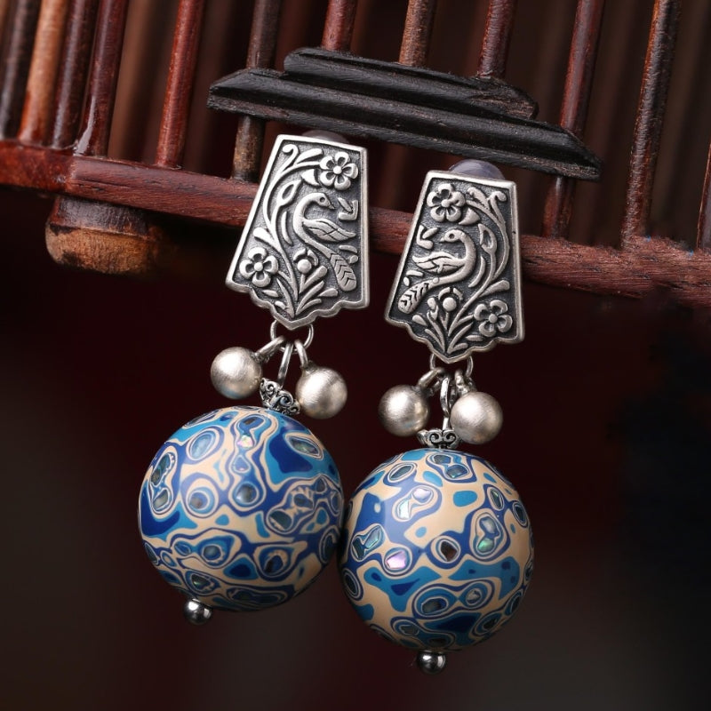 Artful lacquer-style studs earrings, front view