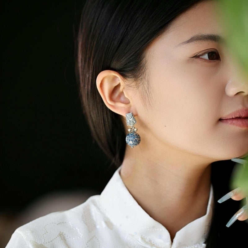 Artful lacquer-style studs earrings, close detail