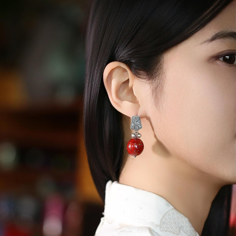 Artful lacquer-style studs earrings, side profile