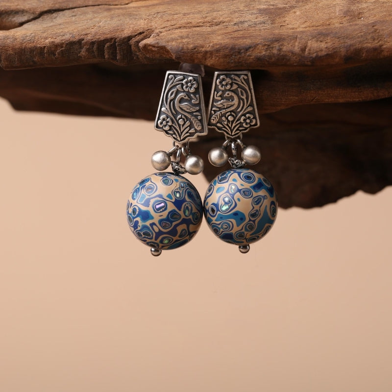 Artful lacquer-style studs earrings, worn styling view