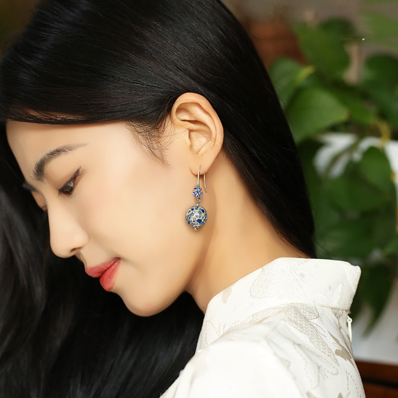 Bold lacquer-style earrings earrings, close detail