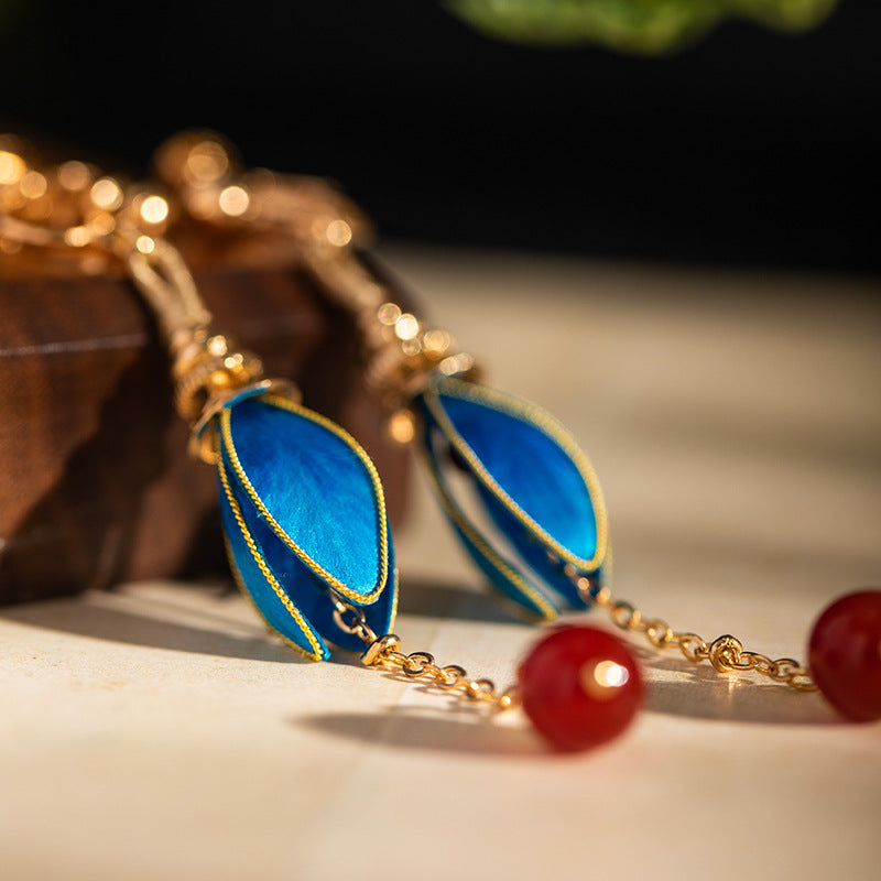 Vintage-style pendant drops earrings, worn styling view