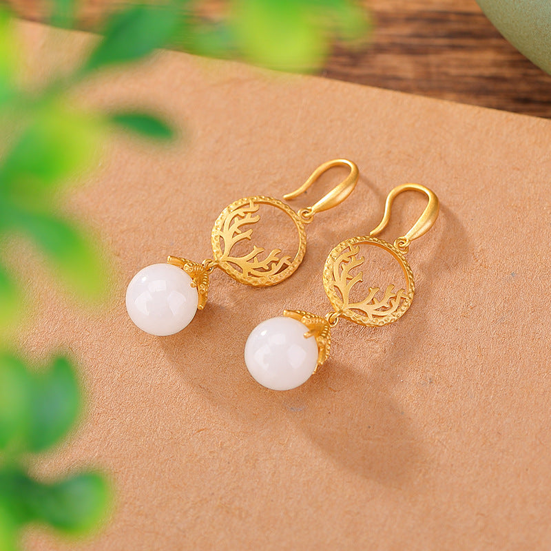 Openwork jade-style drops earrings, side profile