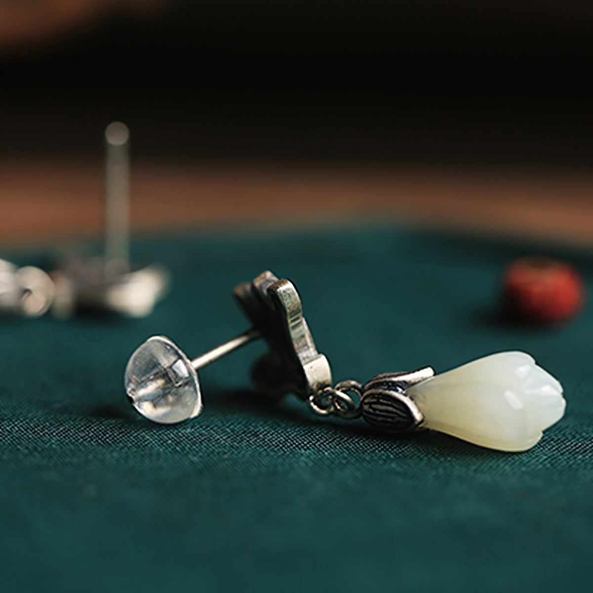Magnolia jade-style drops earrings, side profile