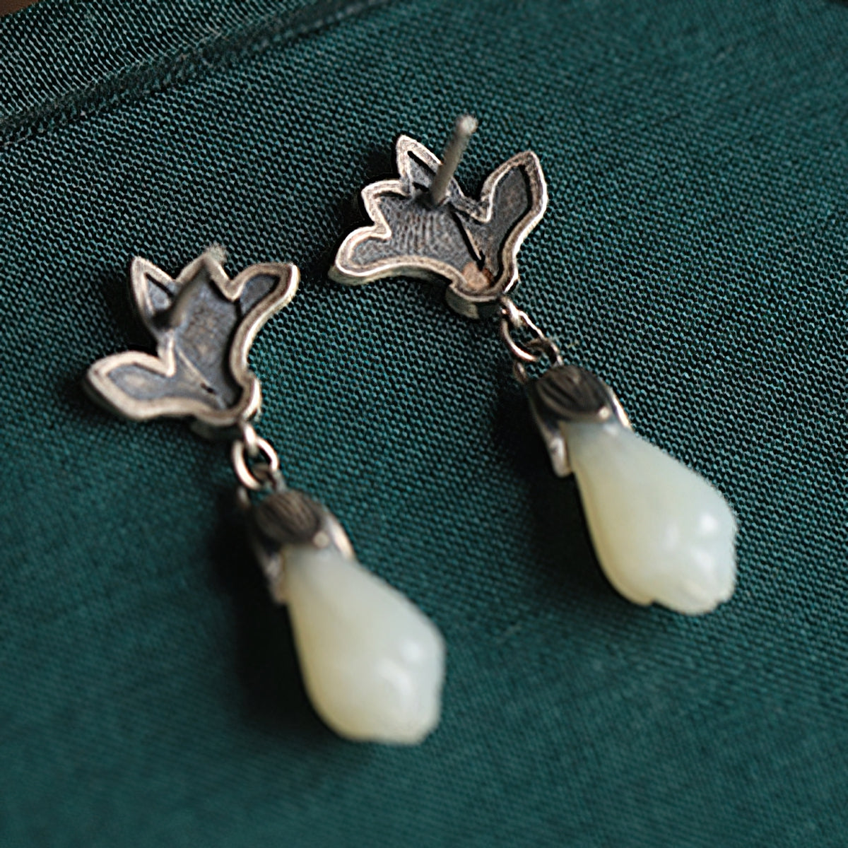 Magnolia jade-style drops earrings, worn styling view