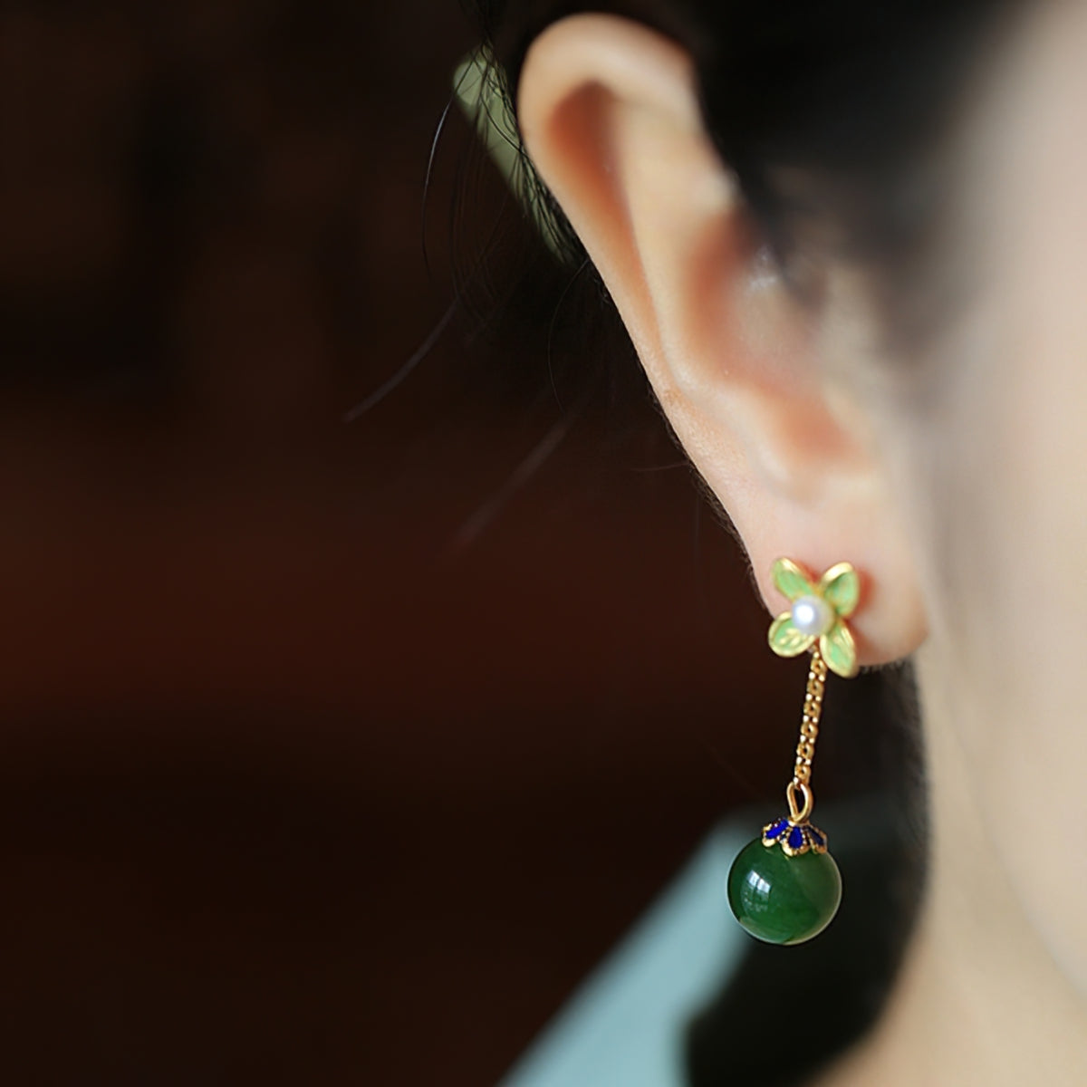 Jade-style silver-tone drops earrings, side profile