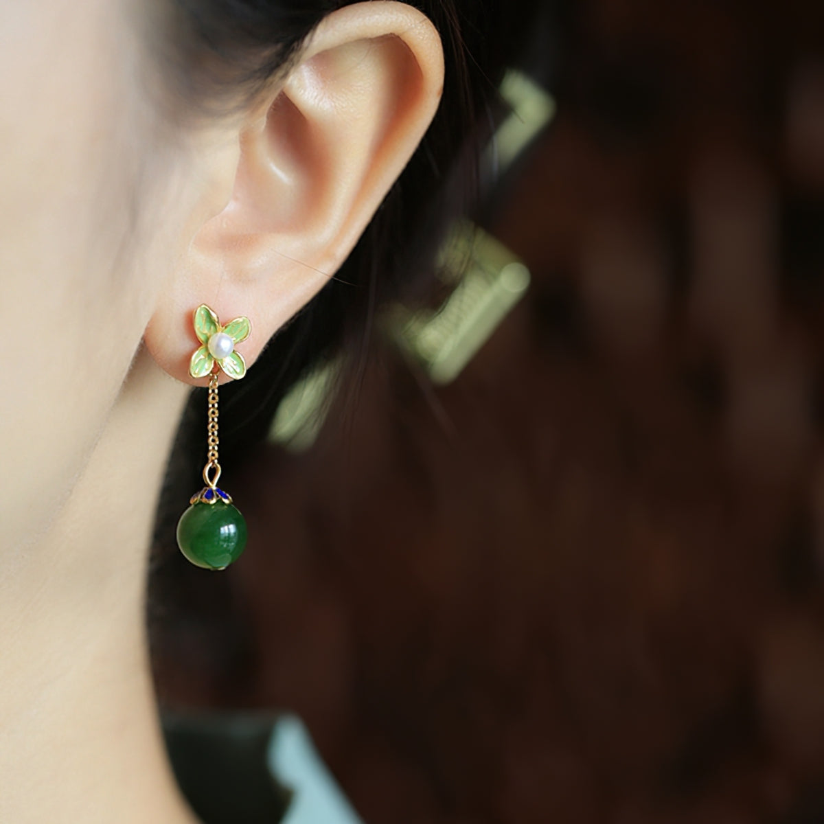 Jade-style silver-tone drops earrings, close detail