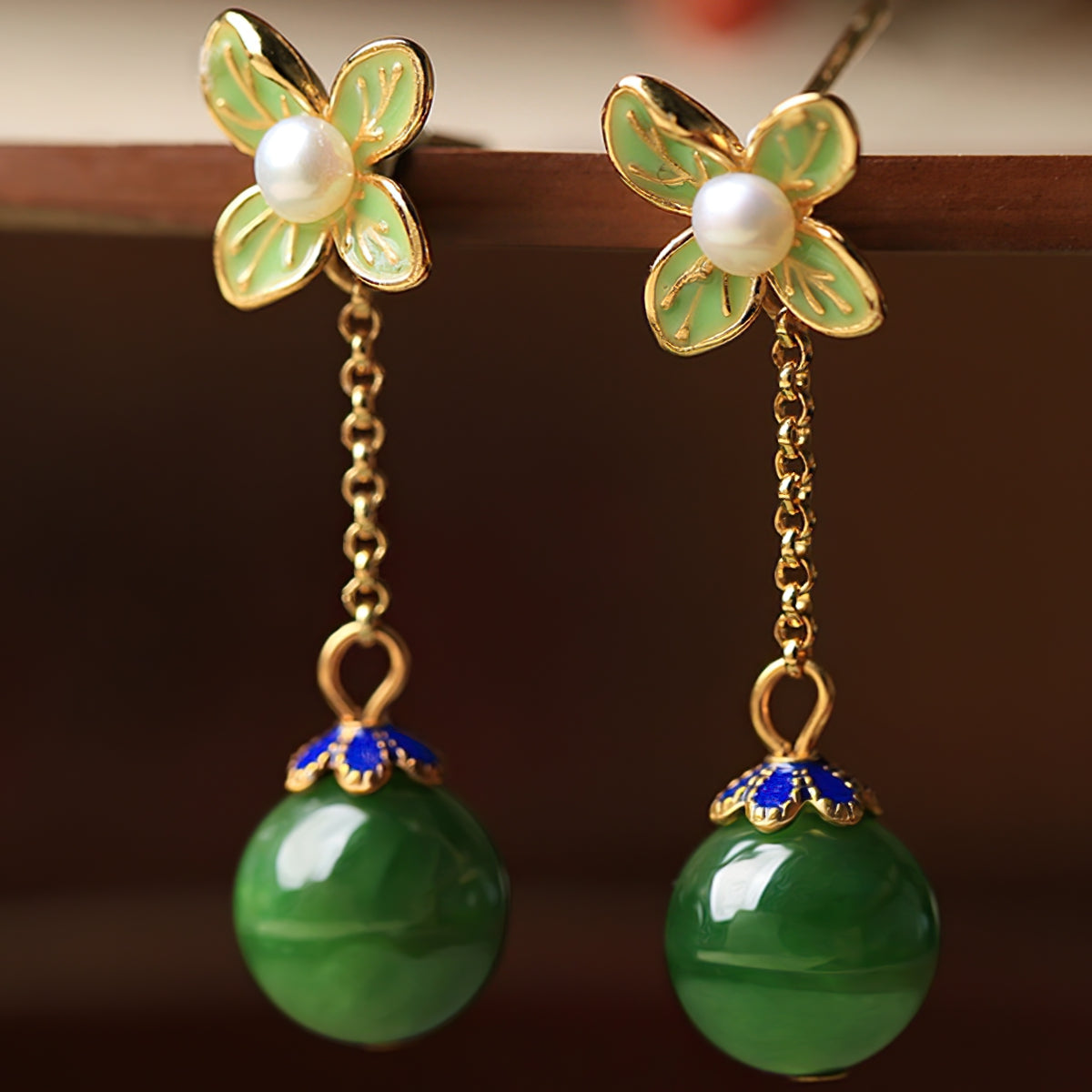 Jade-style silver-tone drops earrings, worn styling view