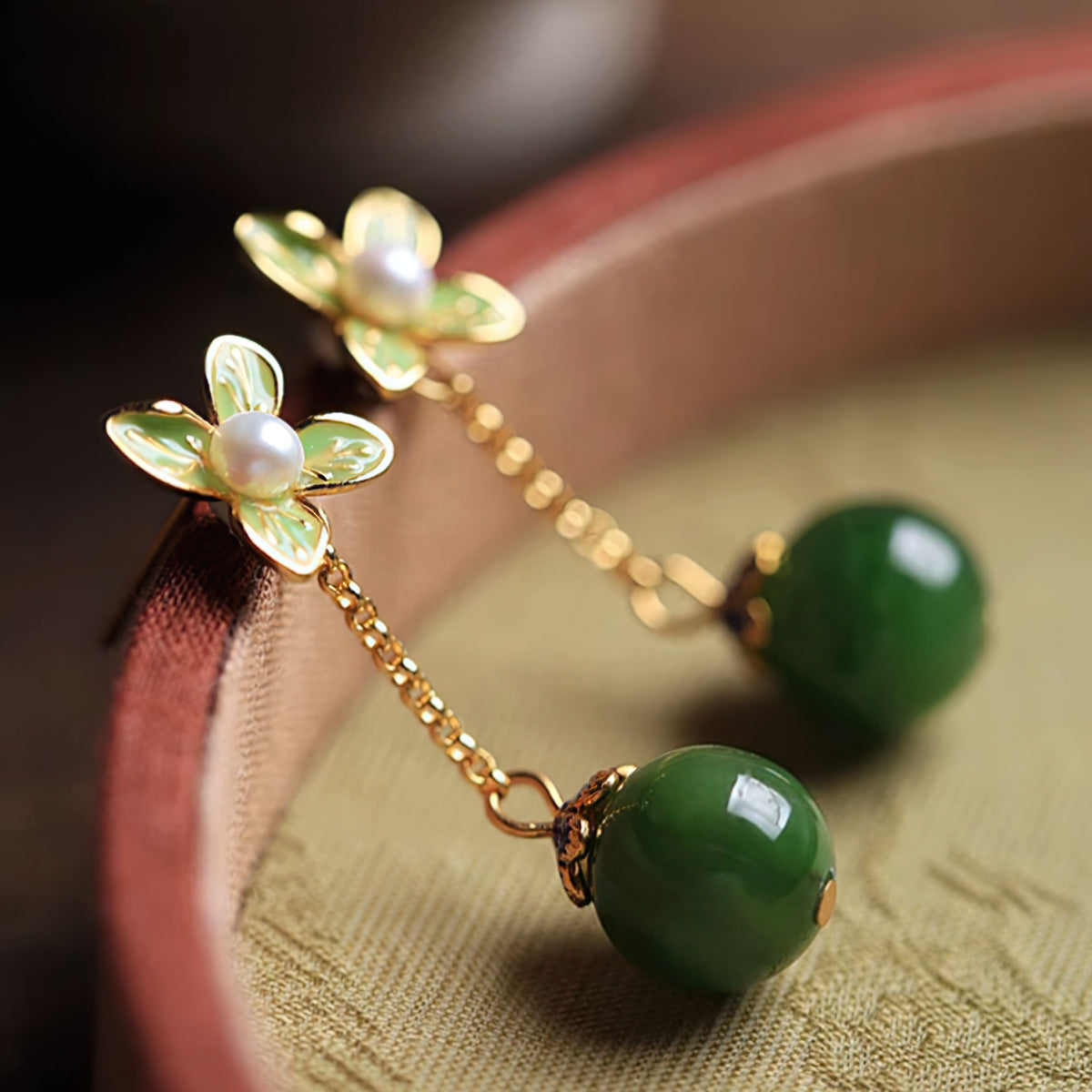 Jade-style silver-tone drops earrings, front view