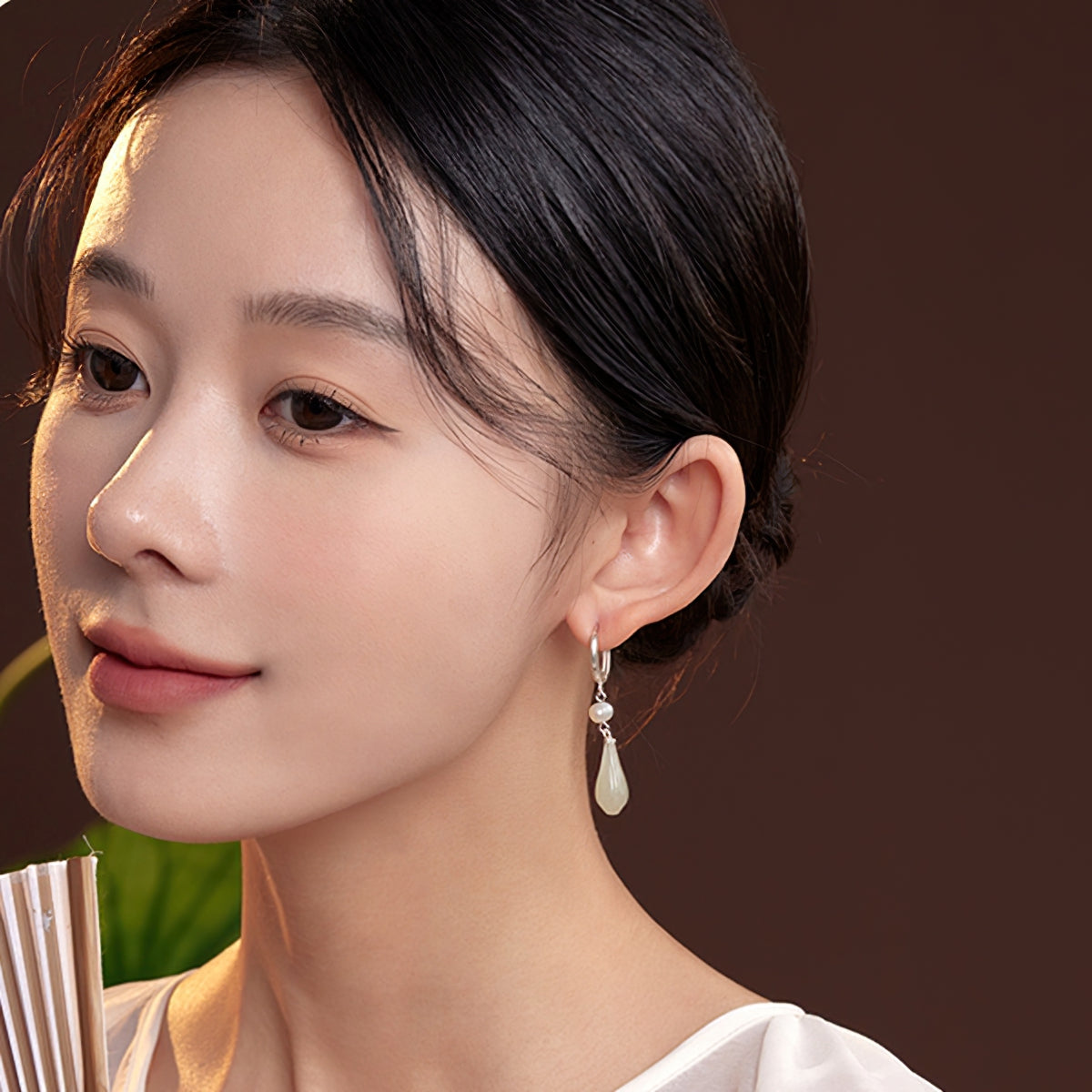 Elegant jade-style dangles earrings, side profile