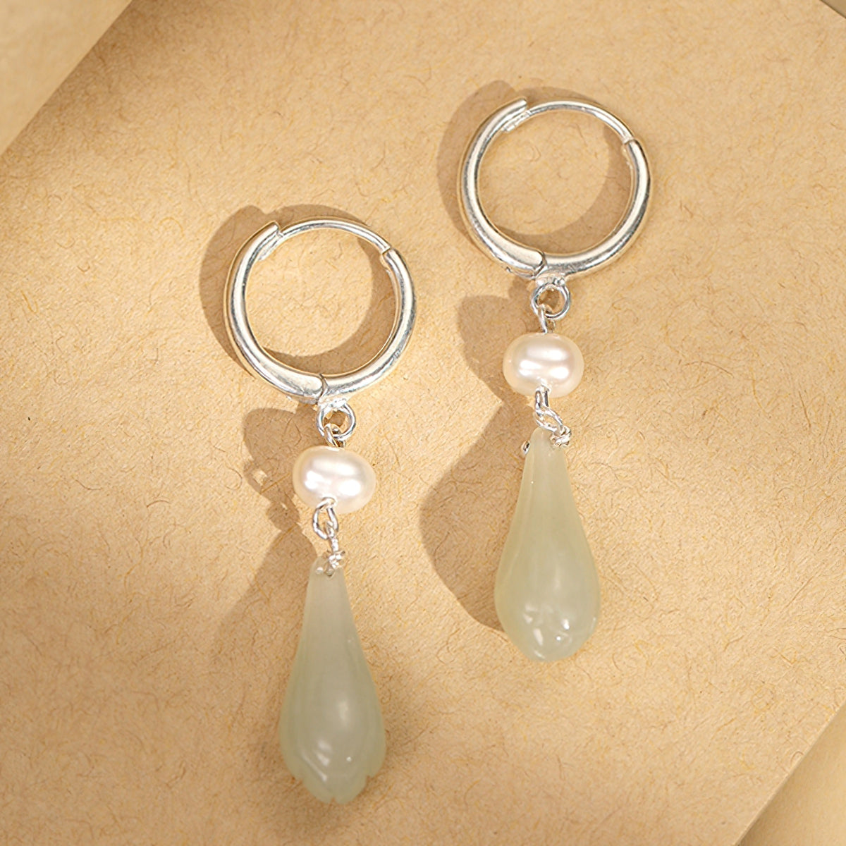 Elegant jade-style dangles earrings, front view