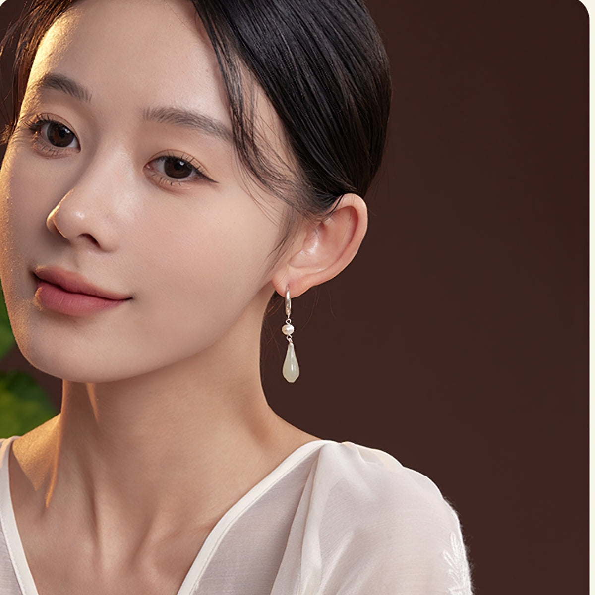 Elegant jade-style dangles earrings, worn styling view