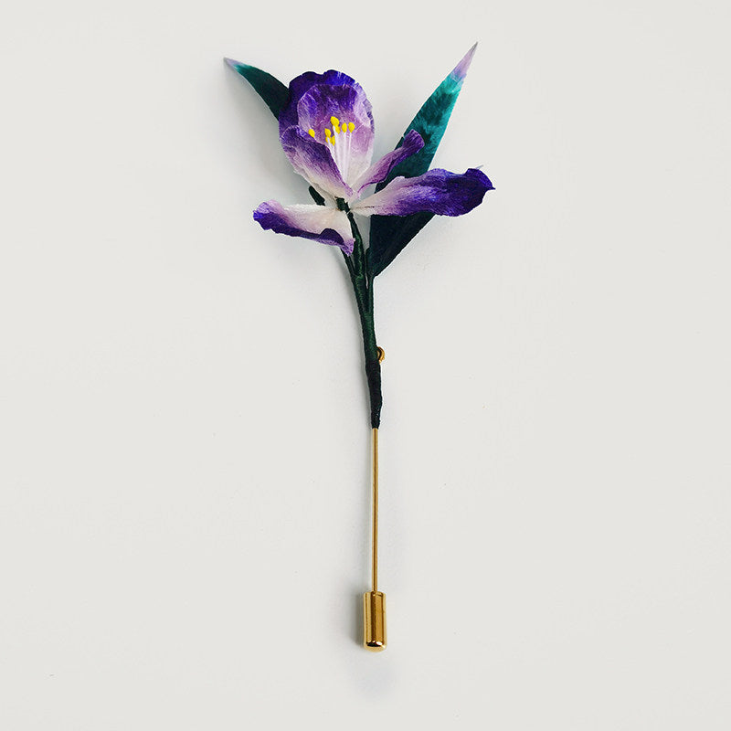 purple iris brooch pin styled on a blazer