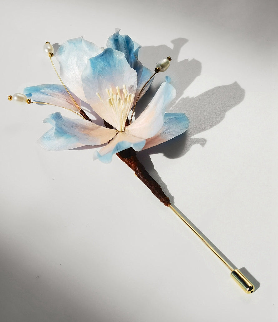 Angled view showing floral silhouette and layered petals, ideal for lapels