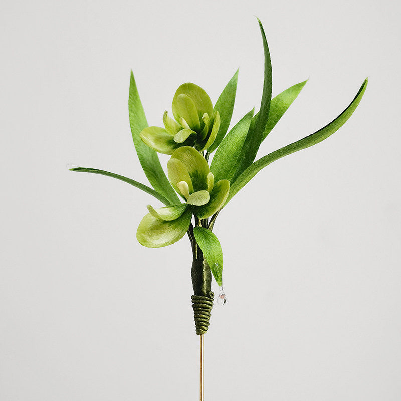 Vertical view showing layered leaf motifs along an elegant slim pin