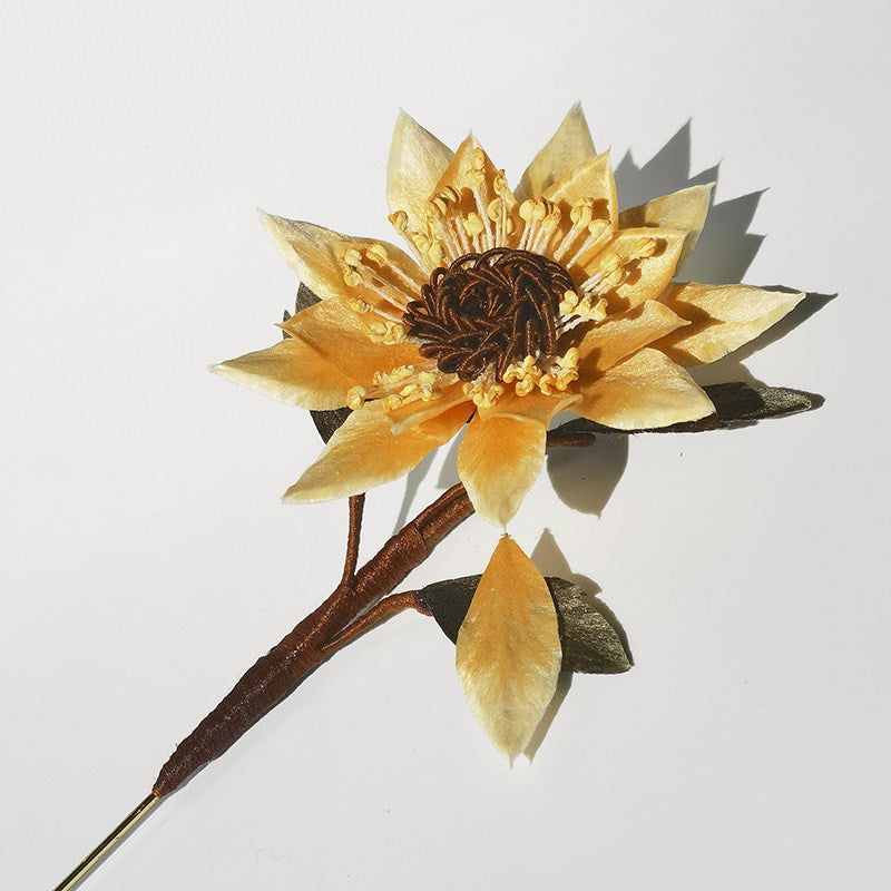 sunflower brooch pin styled on a sweater viewed close up