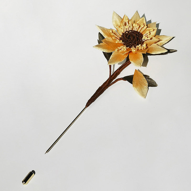 sunflower brooch pin styled on a sweater styled for an occasion