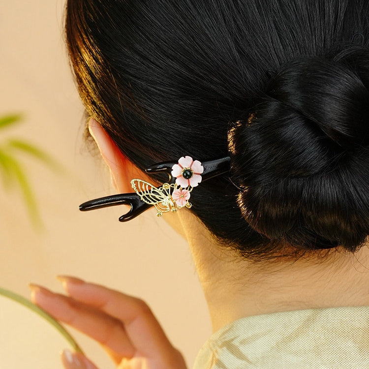 Lightweight black and pink stick worn in a soft bridal updo