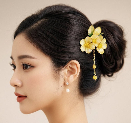 Woman with a floral hairpin in her hair against a beige background