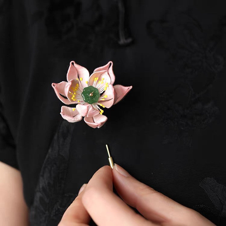 Close-up worn on collar showing subtle shimmer and secure clasp