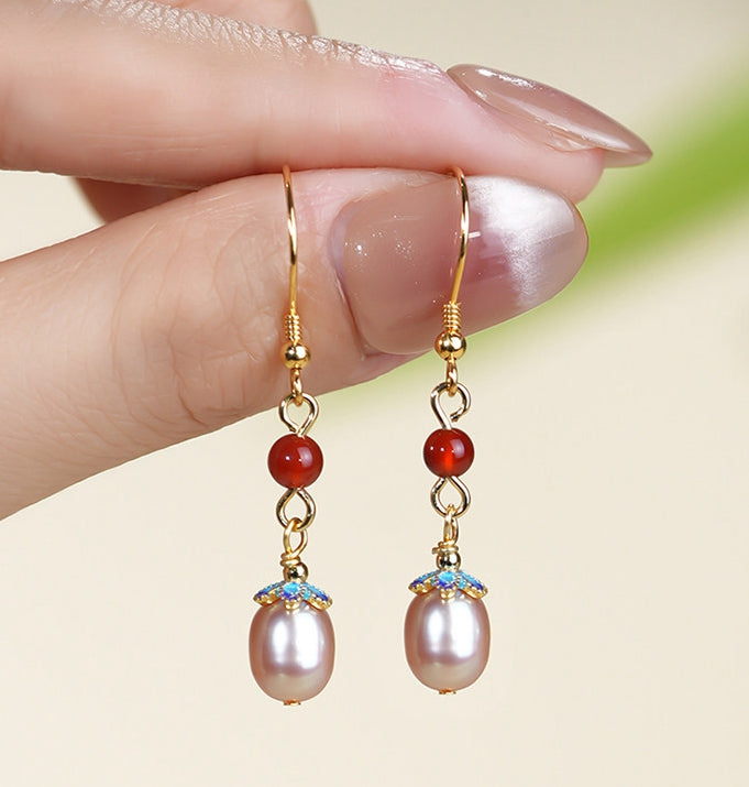 Red stone and pearl drops earrings, worn styling view