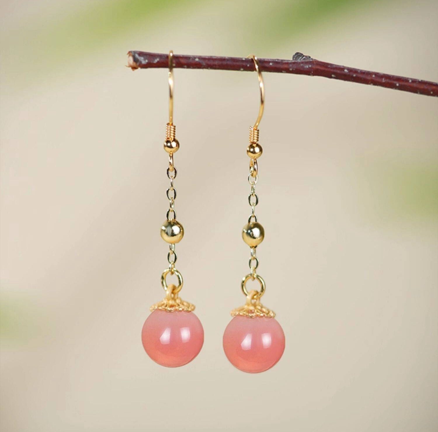 Pink stone dangles earrings, paired display